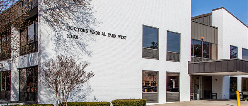 A white brick medical professionals building is home to MedStar Health Primary Care at Silver Spring.