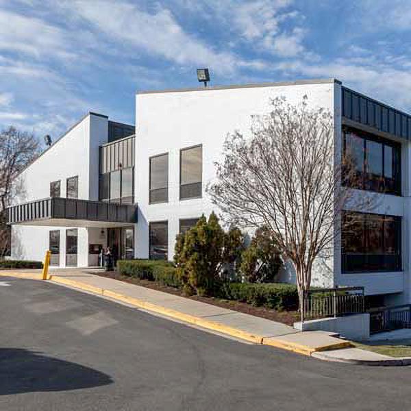 A white brick medical professionals building is home to MedStar Health Primary Care at Silver Spring.