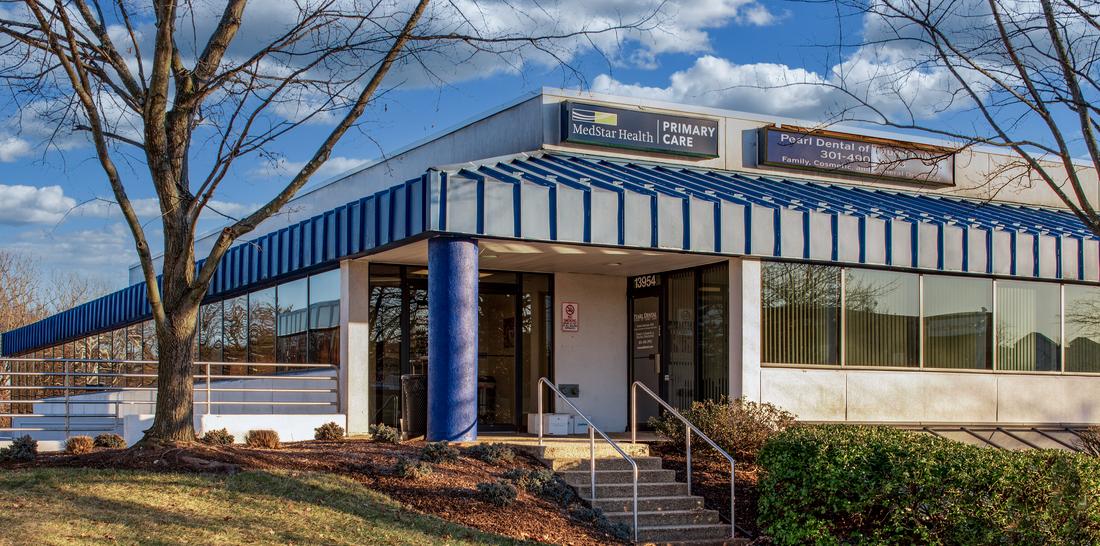 MedStar Health Primary Care in Laurel at Baltimore Avenue is located in a one-story office building with a blue metal roof.