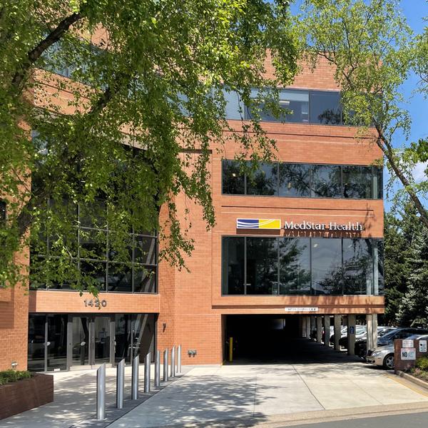 Entrance to 1420 Beverly Road - a red brick office building where MedStar Primary Care is located. 