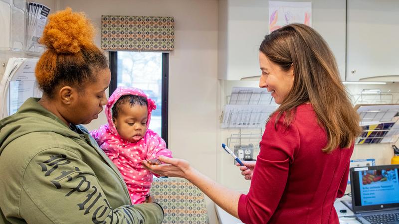 Dr. Janine Rethy, chief of Community Pediatrics at MedStar Georgetown University Hospital, with a new mom and her baby.