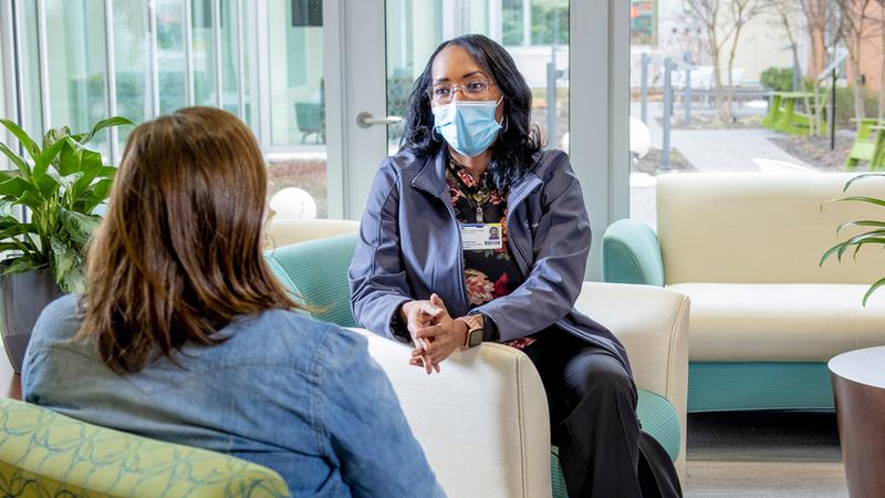 Pictured above, Lakeitha Gross, a peer recovery coach meets with a patient at MedStar Franklin Square Medical Center.