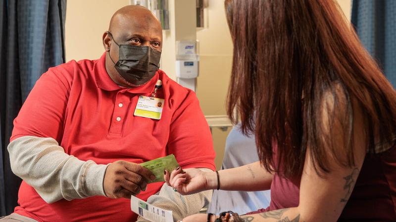 Jerry Gross, a peer recovery coach at MedStar Health Harbor Hospital with a patient.