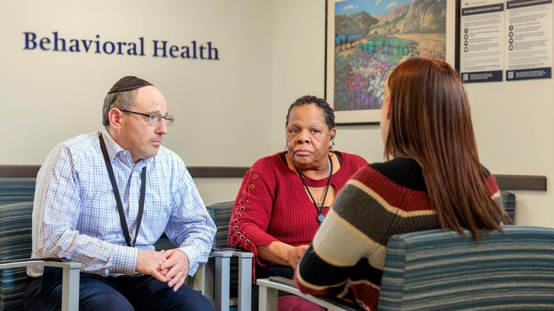 Joseph Levin and Lois Jacobs talk with a patient at MedStar Union Memorial Hospital.
