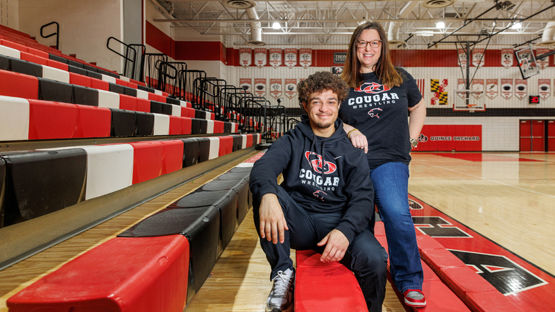 Astone Hunte and his mother, Annie, in the gymnasium at his high school.