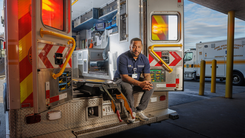 Anthony Carter, hospital responder, sits on the back of an ambulance at MedStar Health.