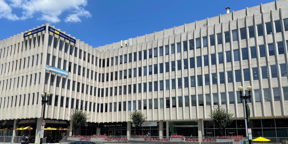 2233 Wisconsin Avenue, Washington DC is a large grey concrete office building where MedStar Georgetown's General Medicine and Pediatrics is located.