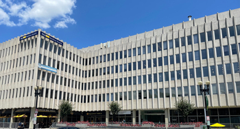 2233 Wisconsin Avenue, Washington DC is a large grey concrete office building where MedStar Georgetown's General Medicine and Pediatrics is located.