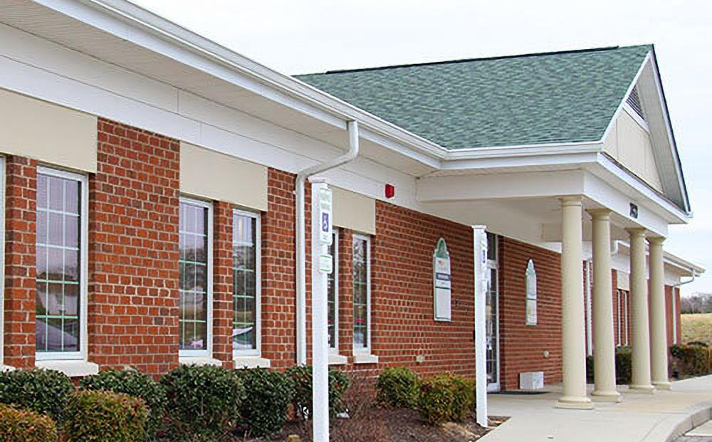 MedStar Health Orthopedics at Leonardtown is located in a one-story brick building office with white columns.