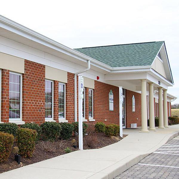 MedStar Health Orthopedics at Leonardtown is located in a one-story brick building office with white columns.