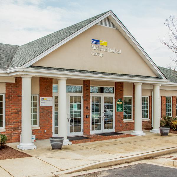 MedStar Health Primary Care at St Clements is located in a one-story brick professional building with white columns. 