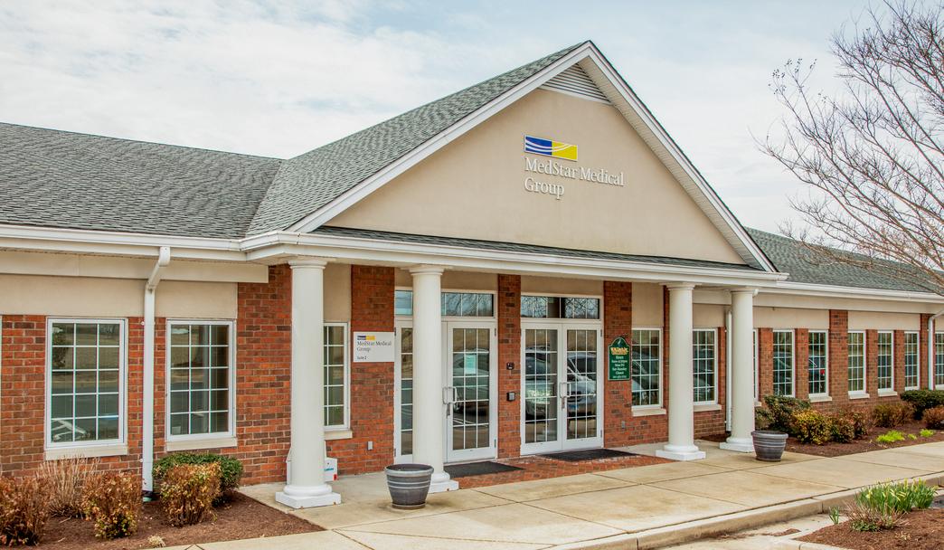 MedStar Health Primary Care at St Clements is located in a one-story brick professional building with white columns. 