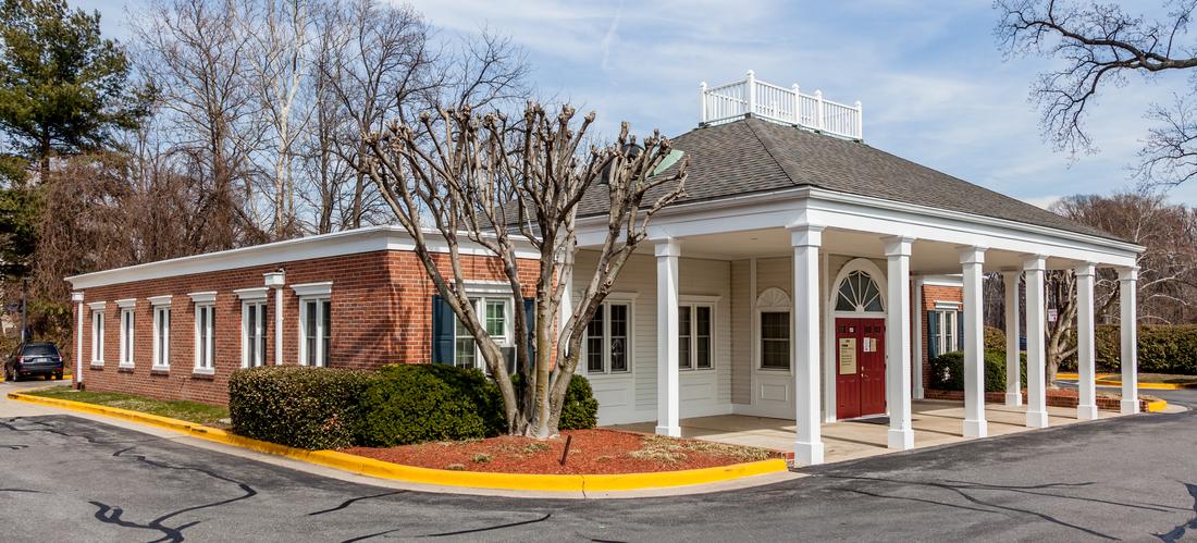 MedStar Primary Care at Olney Professional Park is located in a quaint 1-story brick building with white columns.
