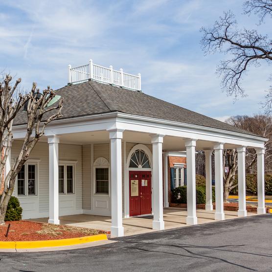 MedStar Primary Care at Olney Professional Park is located in a quaint 1-story brick building with white columns.