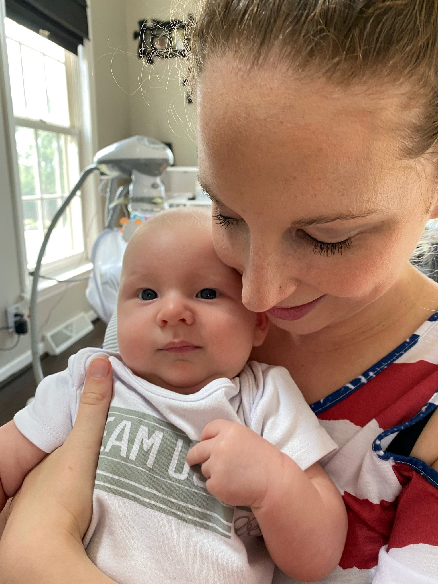 Shayna Frost holds her newborn baby.