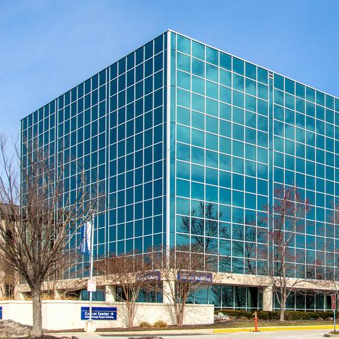The Russell Morgan building on the campus of MedStar Health Good Samaritan Hospital is a modern blue-green glass building.