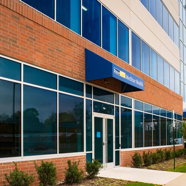 MedStar Health Primary Care at Annapolis is located in a brick, concrete and glass building with a blue awning.