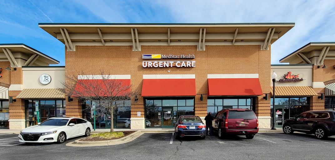 MedStar Health Urgent Care at Arundel Mills is in a shopping center and has a red awning.