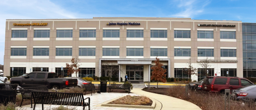 A grey concrete and glass office building is the location for MedStar Shah Medical Group at Brandywine Medical Center.