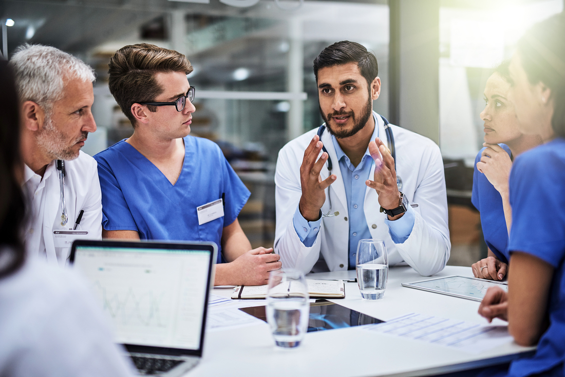 A group of diverse healthcare professionals in a meeting