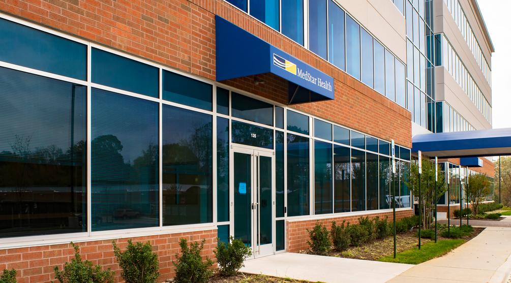 MedStar Health Primary Care at Annapolis is located in a brick, concrete and glass building with a blue awning.