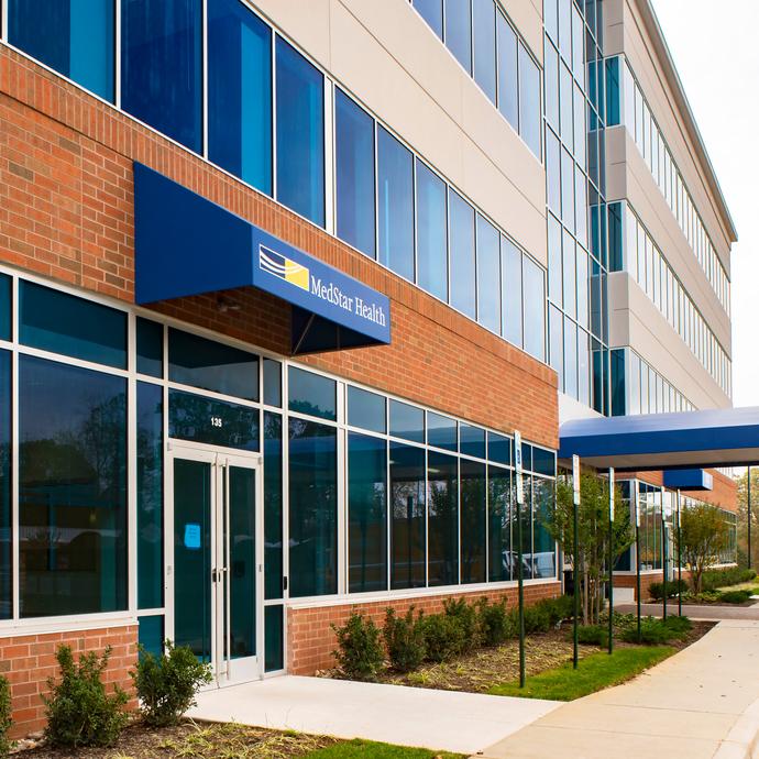 MedStar Health Primary Care at Annapolis is located in a brick, concrete and glass building with a blue awning.