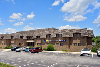 A 2-story brick building with a red metal roof is the location for MedStar Health Primary Care at Upper Marlboro, Maryland.