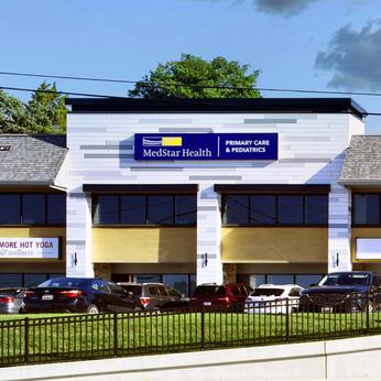 MedStar Health Primary Care at Parkville is located in a green and stone building.