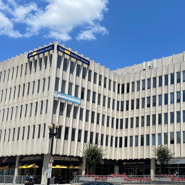 2233 Wisconsin Avenue, Washington DC is a large grey concrete office building where MedStar Georgetown's General Medicine and Pediatrics is located.