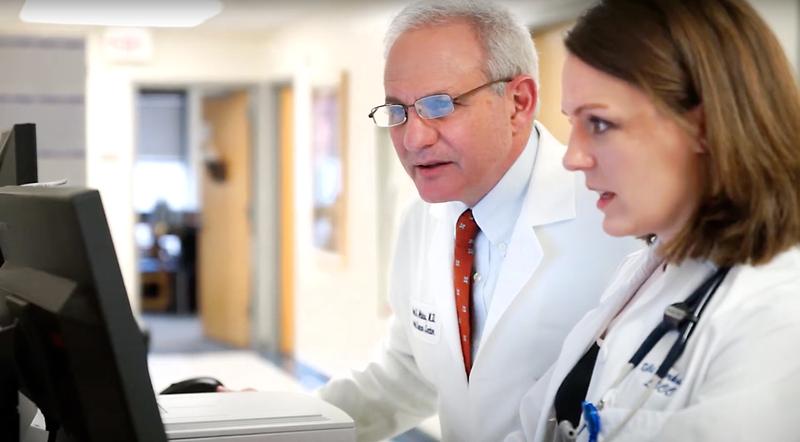 Dr Michael Atkins confers with a colleague at the Lombardi Cancer Institute at MedStar Georgetown University Hospital.