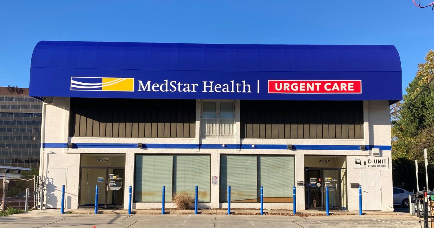 Front entrance with blue awning for MedStar Health Urgent Care at Bethesda on Stanford Street