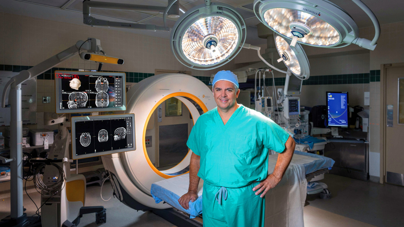Dr. Edward Aulisi, neurosurgeon, stands in an operating room at MedStar Health.