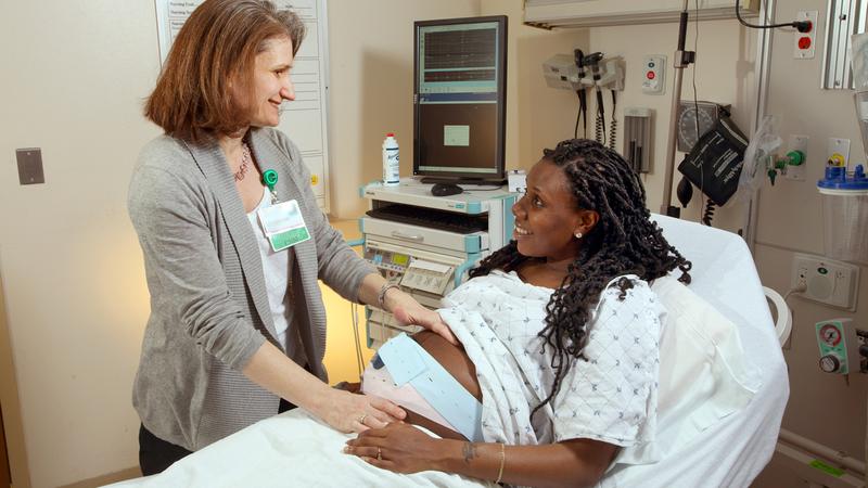 Loral Patchen, MedStar Health midwife, vists with a patient in her hospital room.