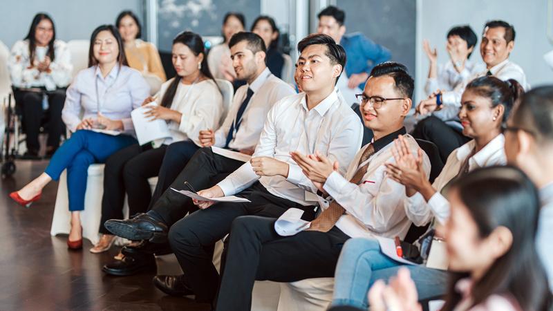 An audience listens to a presentation.