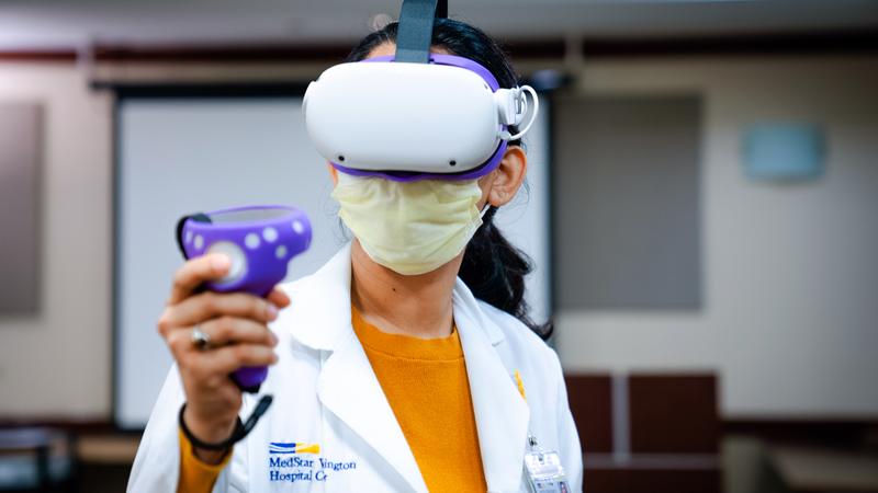 MedStar Health resident Imad Issac uses a virtual reality headset as part of his medical education training.