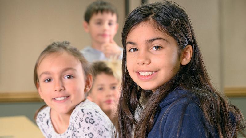 Photo of young kids at school