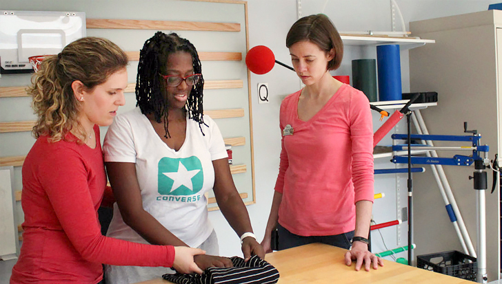 Therapists work with a patient in an occupational therapy rehabilitation gym at MedStar Health.