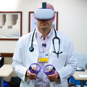MedStar Health resident Imad Issac uses a virtual reality headset as part of his medical education training.