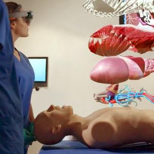 Medical students learn using virtual reality and a simulation mannequin.