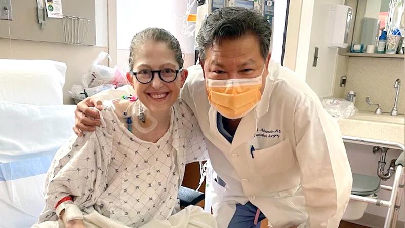 Wendy Ryan receives a hug from Dr Matsumoto, who performed her successful small bowel transplant operation.