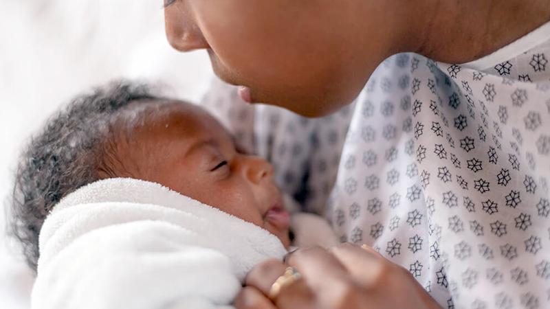 Close up photo of a mother and her newborn baby.