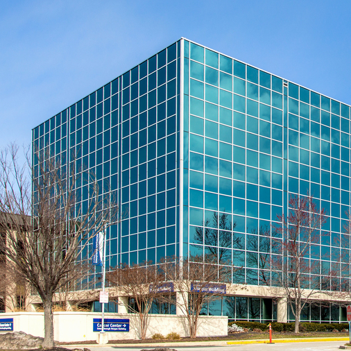 The Russell Morgan building on the campus of MedStar Health Good Samaritan Hospital is a modern blue-green glass building.