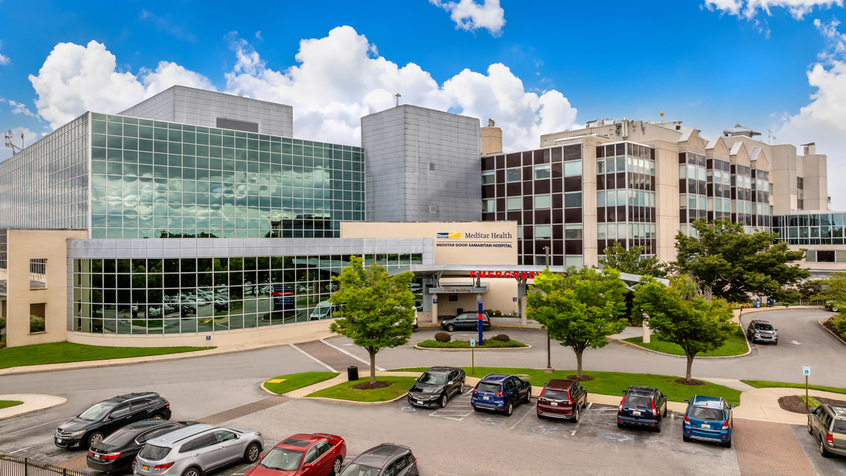 Aerial view of MedStar Good Samaritan Hospital - a modern blue-green glass and concrete building in Baltimore, Maryland.