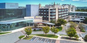 Aerial view of MedStar Good Samaritan Hospital - a modern blue-green glass and concrete building in Baltimore, Maryland.