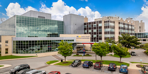 Aerial view of MedStar Good Samaritan Hospital - a modern blue-green glass and concrete building in Baltimore, Maryland.