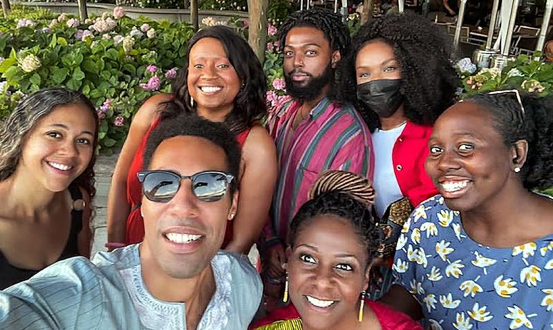 Candid group selfie of members of the MedStar Georgetown University Hospital Black Faculty and Staff Association outdoors in a park.