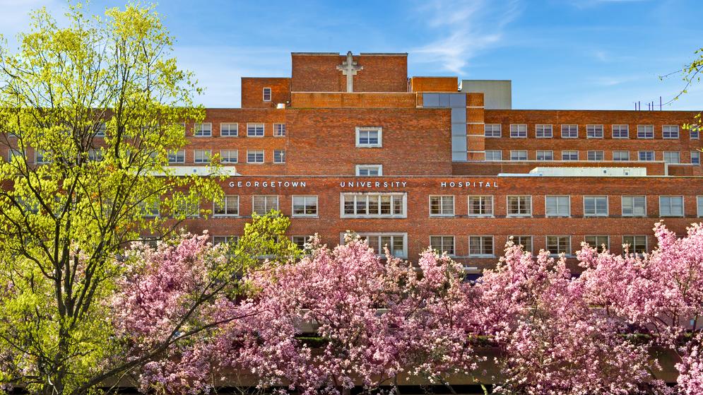 Front of the MedStar Georgetown Hospital building with cherry blossoms in the foreground