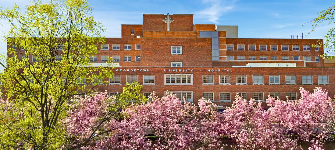 Front of the MedStar Georgetown Hospital building with cherry blossoms in the foreground
