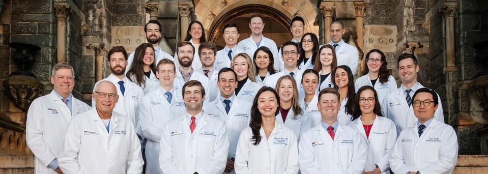 A group of doctors and residents from the Georgetown University Hospital Plastic Surgery Residency Program stand together for a group photo.