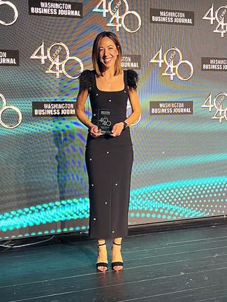 Emily Briton receives a 40 Under 40 award from the Washington Business Journal.